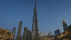 Burj Khalifa skyscraper towering over Dubai city skyline at dusk